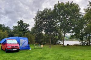 Touring Caravans and Campervans - Camper-van pitched by the lake